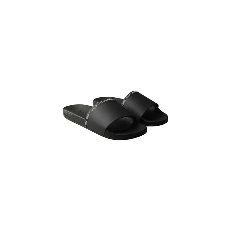 Calvin Klein men slippers black open toe slide sandals with sleek polyurethane design and subtle white branding on strap