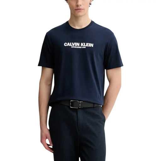 Navy blue Calvin Klein men t-shirt with white Calvin Klein established 1986 logo across the chest