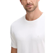 White Calvin Klein men t-shirt featuring a subtle embroidered logo on the left chest for casual wear