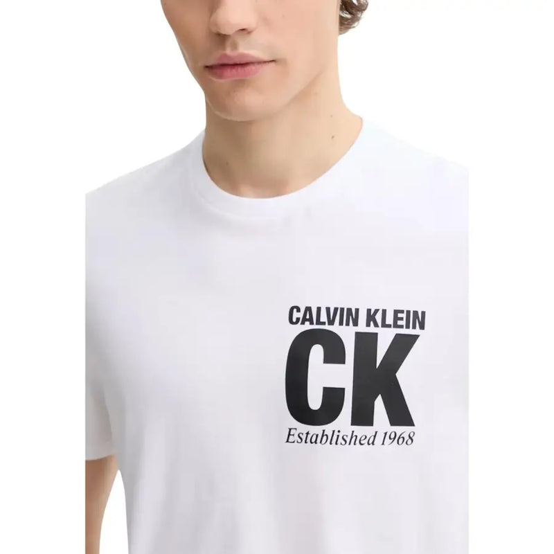 White Calvin Klein men t-shirt featuring bold black CK logo and established 1968 text on the front