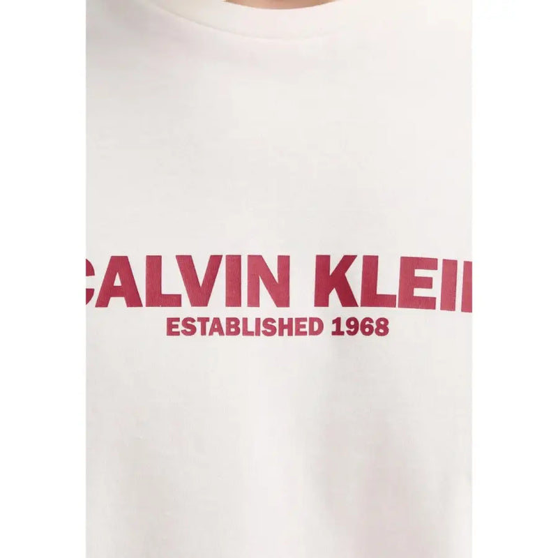 White Calvin Klein men t-shirt with bold red Calvin Klein and established 1968 lettering across the chest