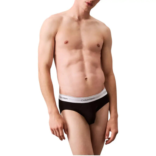 Black calvin klein men underwear briefs with white waistband featuring calvin klein logo for comfortable daily wear
