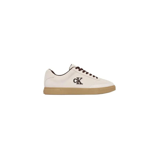 Calvin Klein men white suede sporty low-top sneaker with black laces tan rubber sole and ck logo on side