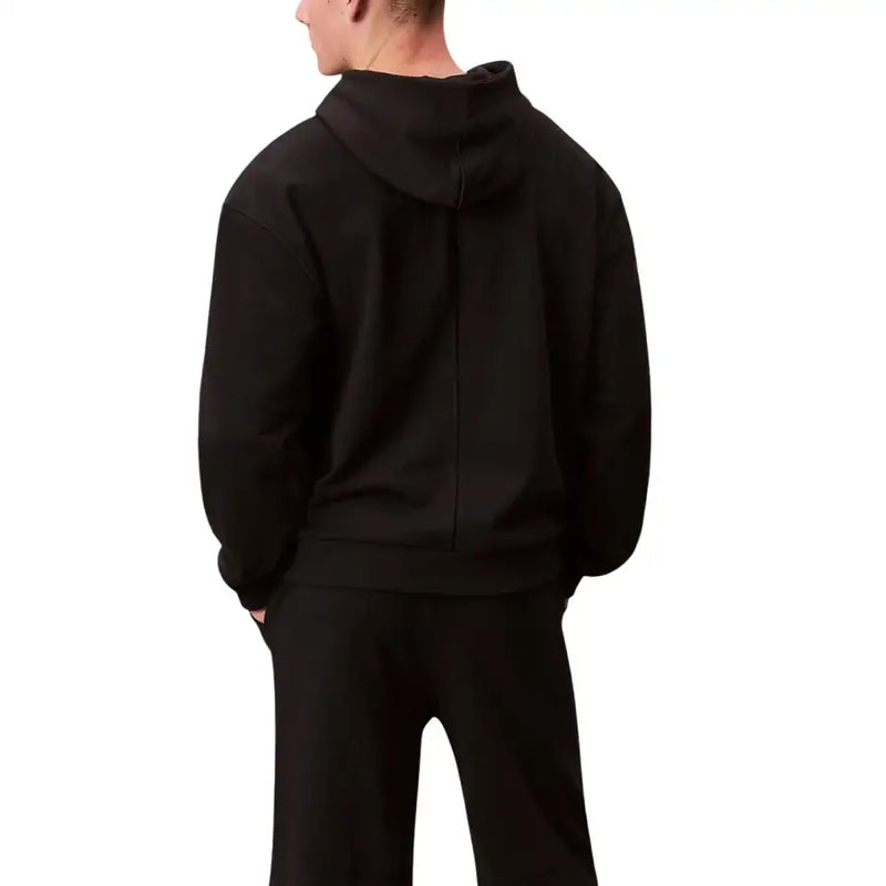 Calvin Klein Sport Sweat à capuche noir en coton pour homme, vu de dos, avec une couture centrale sur la capuche.
