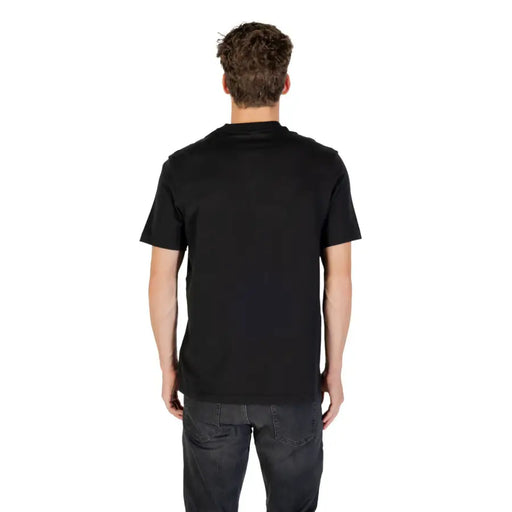 Calvin Klein Sport men’s black short-sleeved round neck T-shirt with dark grey jeans