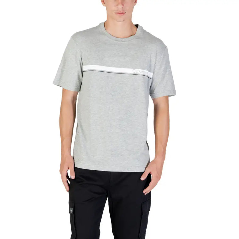Men’s grey round neck T-shirt with white stripe paired with black cargo pants