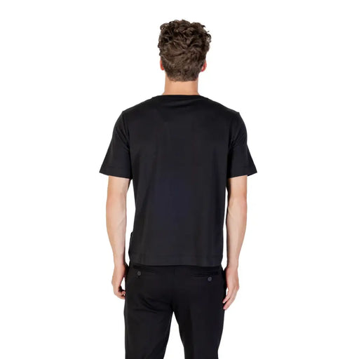 Men’s black short-sleeved round neck T-shirt and black pants from Calvin Klein Sport