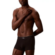 Black Calvin Klein boxer briefs with white elastic waistband featuring logo for men’s underwear use