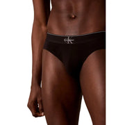 Black calvin klein men briefs with a white logo waistband designed for comfort and everyday wear