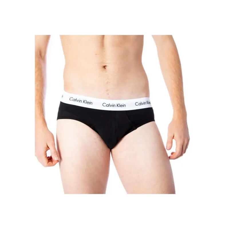 Schwarz Calvin Klein Herrenslips mit weißem elastischem Bund und dem sich wiederholenden Markenlogo aus Baumwollstoff