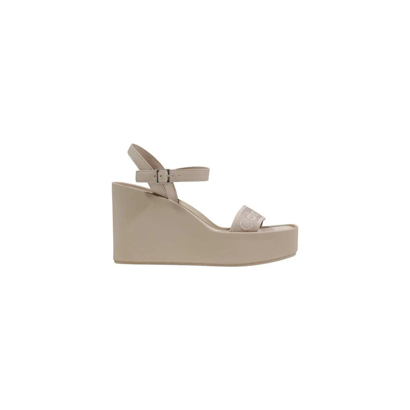 Beige Calvin Klein women platform wedge sandal with thin ankle strap and decorative buckle