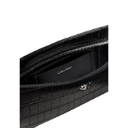 Calvin Klein women black shoulder bag in crocodile-embossed polyurethane with silver zipper and hardware