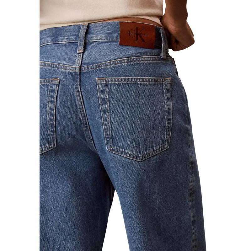 Calvin klein women blue cotton denim jeans showing the back with a brown leather brand patch at the waistband