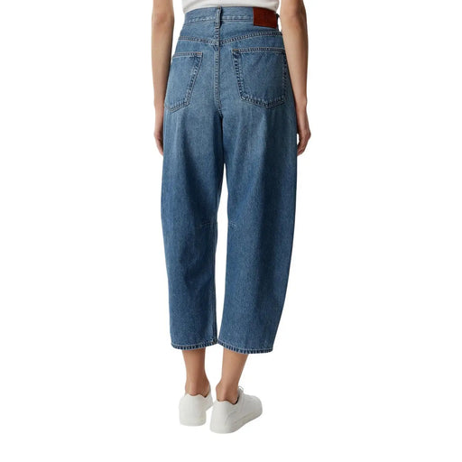 Calvin Klein women blue cotton denim jeans showing the back with high waist wide-leg cut and brown leather belt loop