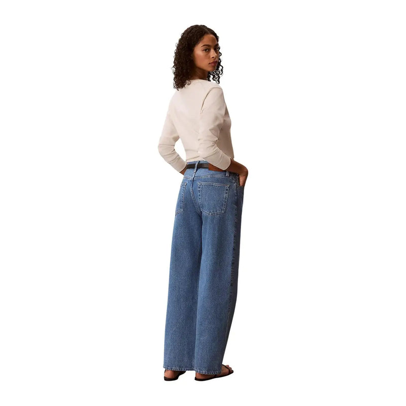 Calvin klein women blue cotton denim wide-leg jeans with relaxed fit and classic back pockets shown from the back