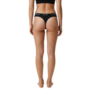 Black calvin klein women brazilian thong underwear in cotton modal with white logo and star pattern shown from the back side