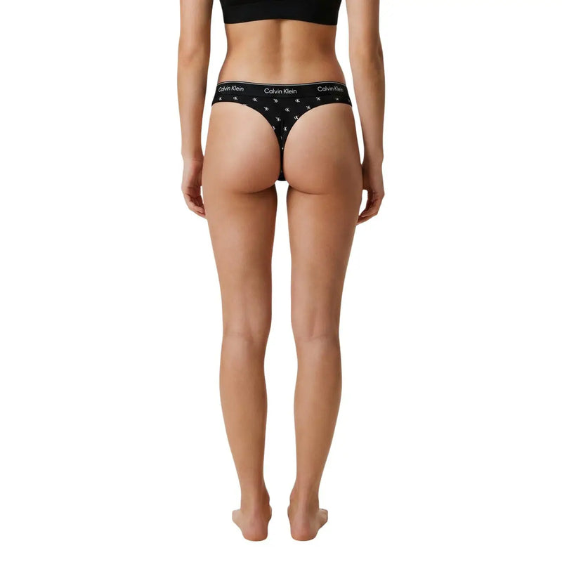Black calvin klein women brazilian thong underwear in cotton modal with white logo and star pattern shown from the back side