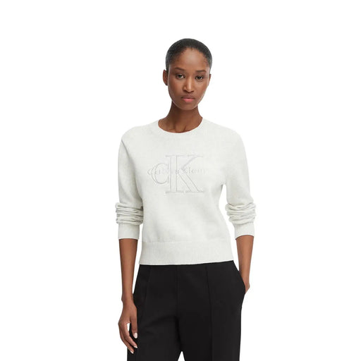 Cream-colored Calvin Klein women cotton knitwear sweater with round neck and subtle embroidered logo on the chest