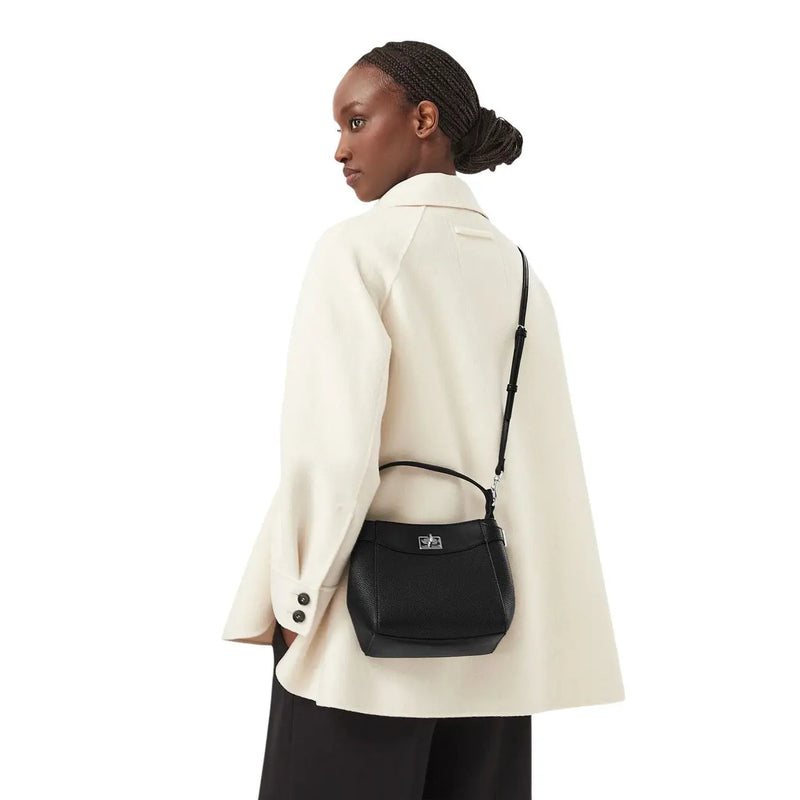 Black textured leather Calvin Klein women crossbody bag with silver-tone hardware and adjustable strap in polyurethane