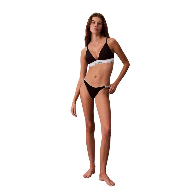 Black calvin klein bikini set featuring a cotton triangle top with white elastic band and matching thong bottom