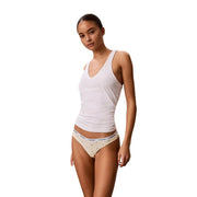 White Calvin Klein cotton tank top with v-neck and subtle branding on waistband shown with grey thong underwear pack