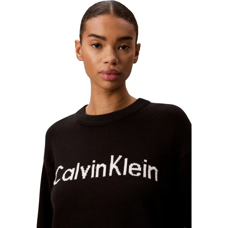 Calvin Klein women knitwear black cotton round neck sweater with white knitted logo across the chest