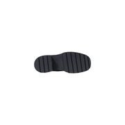 Black rubber sole with chunky block heel and vertical grooves for traction on calvin klein women leather slip on shoes black