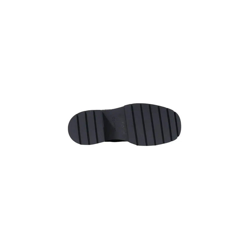 Black rubber sole with chunky block heel and vertical grooves for traction on calvin klein women leather slip on shoes black