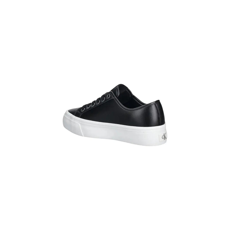 Back view of calvin klein women leather sneaker in black with white rubber sole and silver logo on heel
