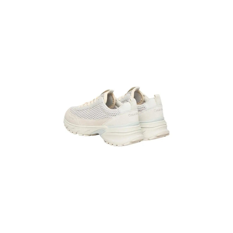 Back view of cream-colored mesh and synthetic leather calvin klein women leather sneakers with chunky sole and branding