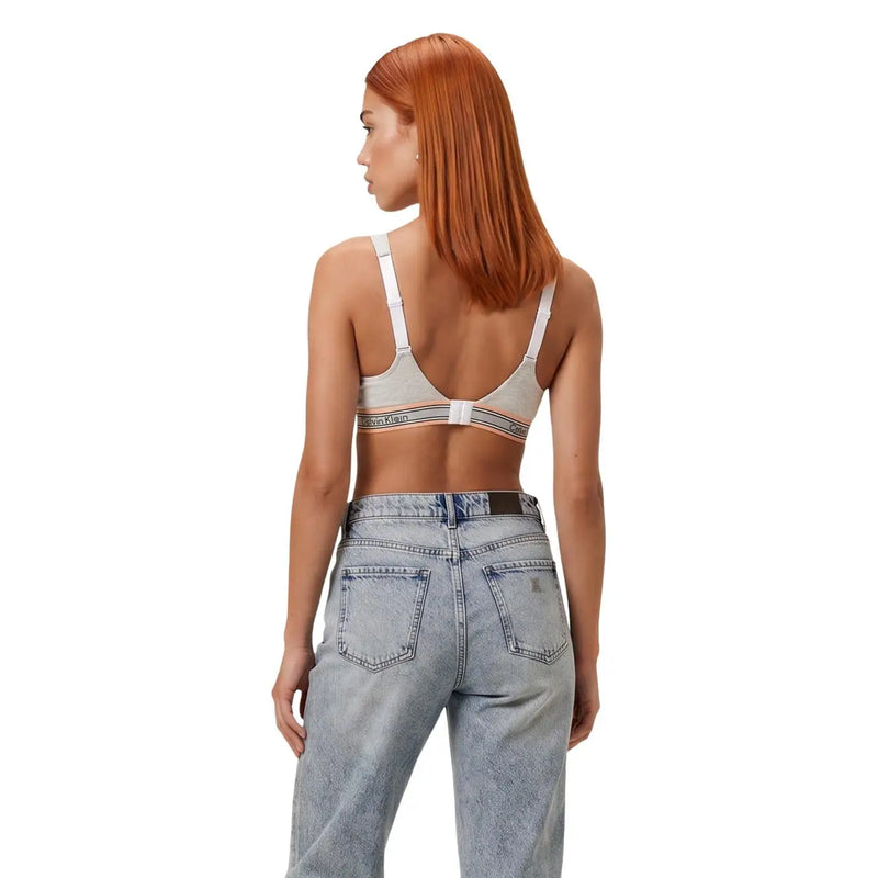 Beige calvin klein women lift bralette with white straps and striped band in cotton modal stretch shown from back
