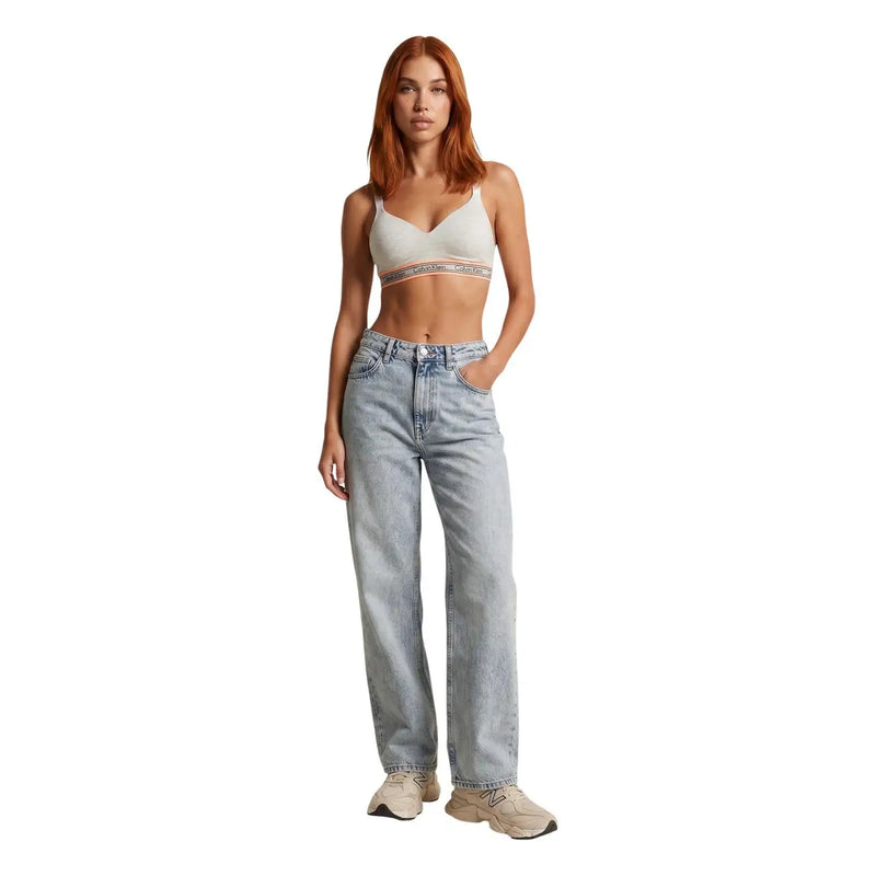 Light-wash denim jeans with straight-leg cut and classic five-pocket design paired with Calvin Klein women lift bralette white cotton modal stretch