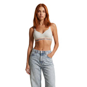 A light gray Calvin Klein women lift bralette with peach elastic logo band made of white cotton modal stretch