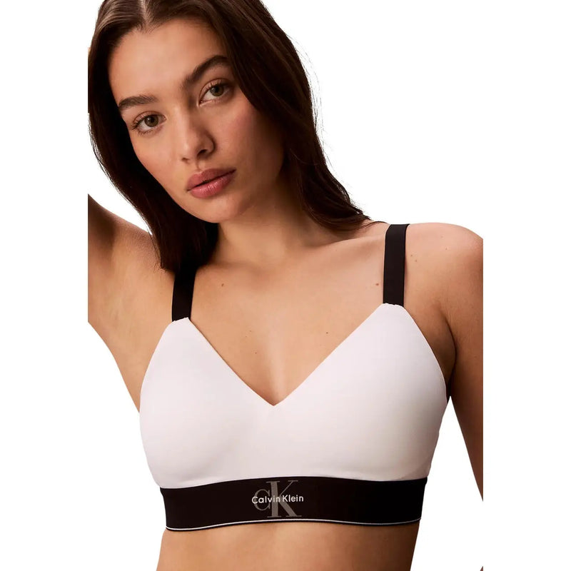 Calvin klein women lightly lined white bralette with black straps and contrasting logo band for comfortable wear