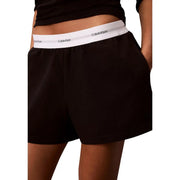 Calvin Klein women logo jersey cotton shorts in black with white elastic waistband featuring black logo text