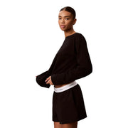 Calvin Klein women logo jersey cotton shorts black paired with a black long-sleeved cropped top with ribbed cuffs