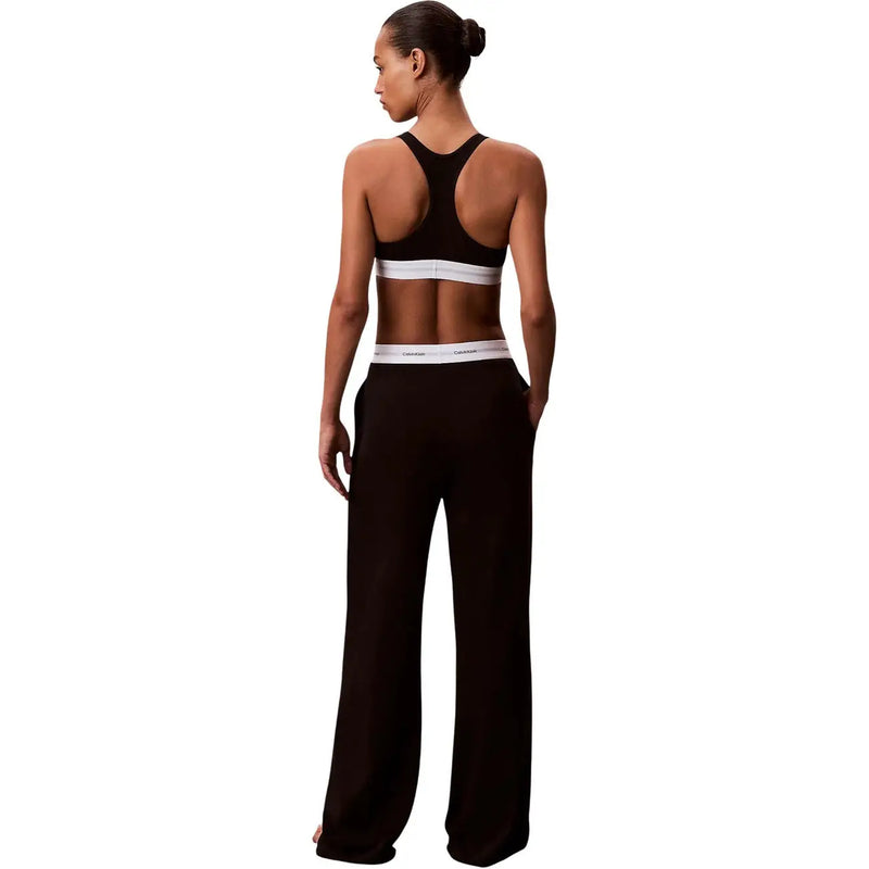 Black Calvin Klein women logo jersey wide-leg cotton pant with a white elastic waistband featuring the brand logo