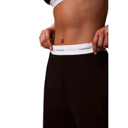 Black Calvin Klein women logo jersey pant underwear with white elastic waistband and black logo text in cotton material