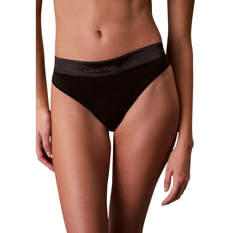 Black Calvin Klein polyester thong with subtle gray logo band for women underwear showing the back side