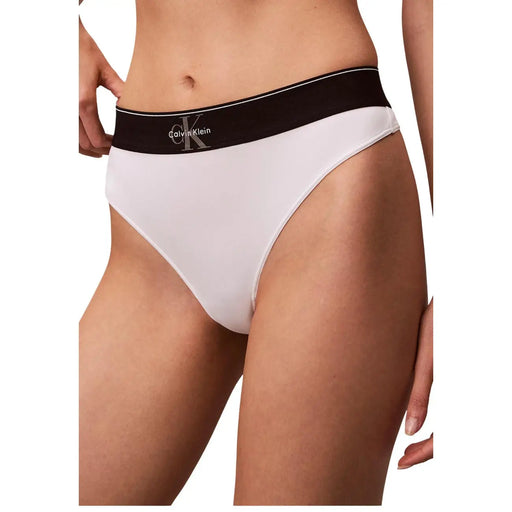 White Calvin Klein polyester thong underwear with black logo waistband designed for women