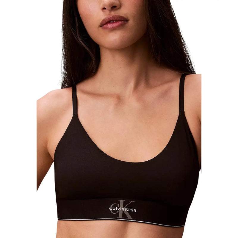 Black calvin klein unlined bralette with thin straps and subtle logo band made of cotton modal for women