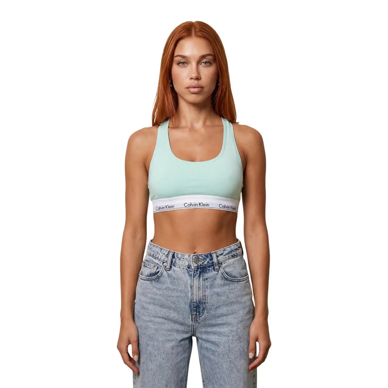 Light green Calvin Klein unlined bra with white logo elastic band made of grey cotton modal for women