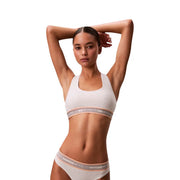 White calvin klein unlined bralette and underwear set with subtle pink trim made from cotton modal fabric