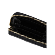 Calvin Klein women wallet in black polyurethane with gold-tone zipper and internal compartments measuring 10x7x2 cm