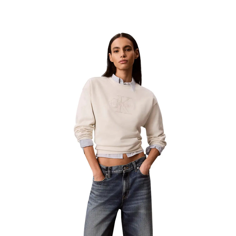 Calvin Klein women white cotton sweatshirt with cream color, subtle embroidered logo, and rolled-up sleeves