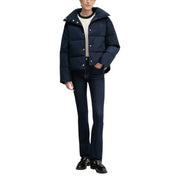 Navy blue quilted puffer jacket with hood and button closures paired with Calvin Klein women’s blue cotton jeans