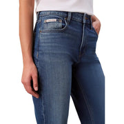 Dark blue cotton stretch calvin klein women’s jeans with classic fit shown from the back pocket side
