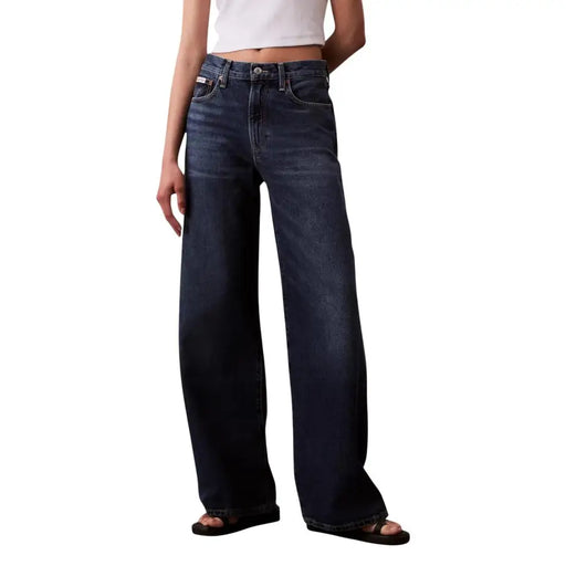 Dark-wash denim jeans with high-rise wide-leg cut and classic five-pocket design from calvin klein bordeaux collection