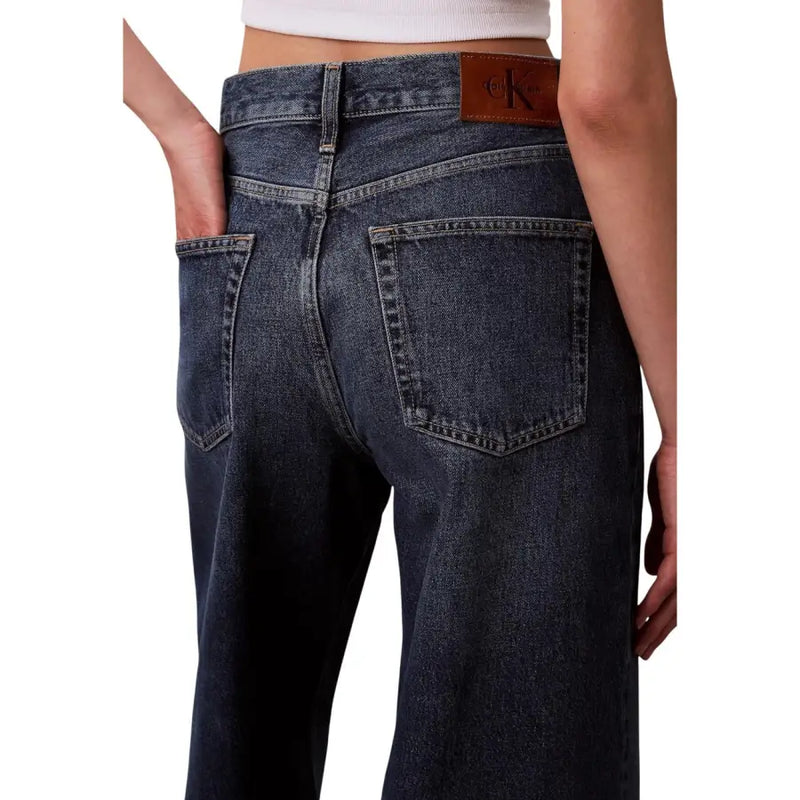 Back view of Calvin Klein womens Bordeaux dark-wash jeans with leather patch
