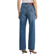 Back side of Calvin Klein women’s light blue cotton denim jeans with embroidered ck logo and brown leather patch
